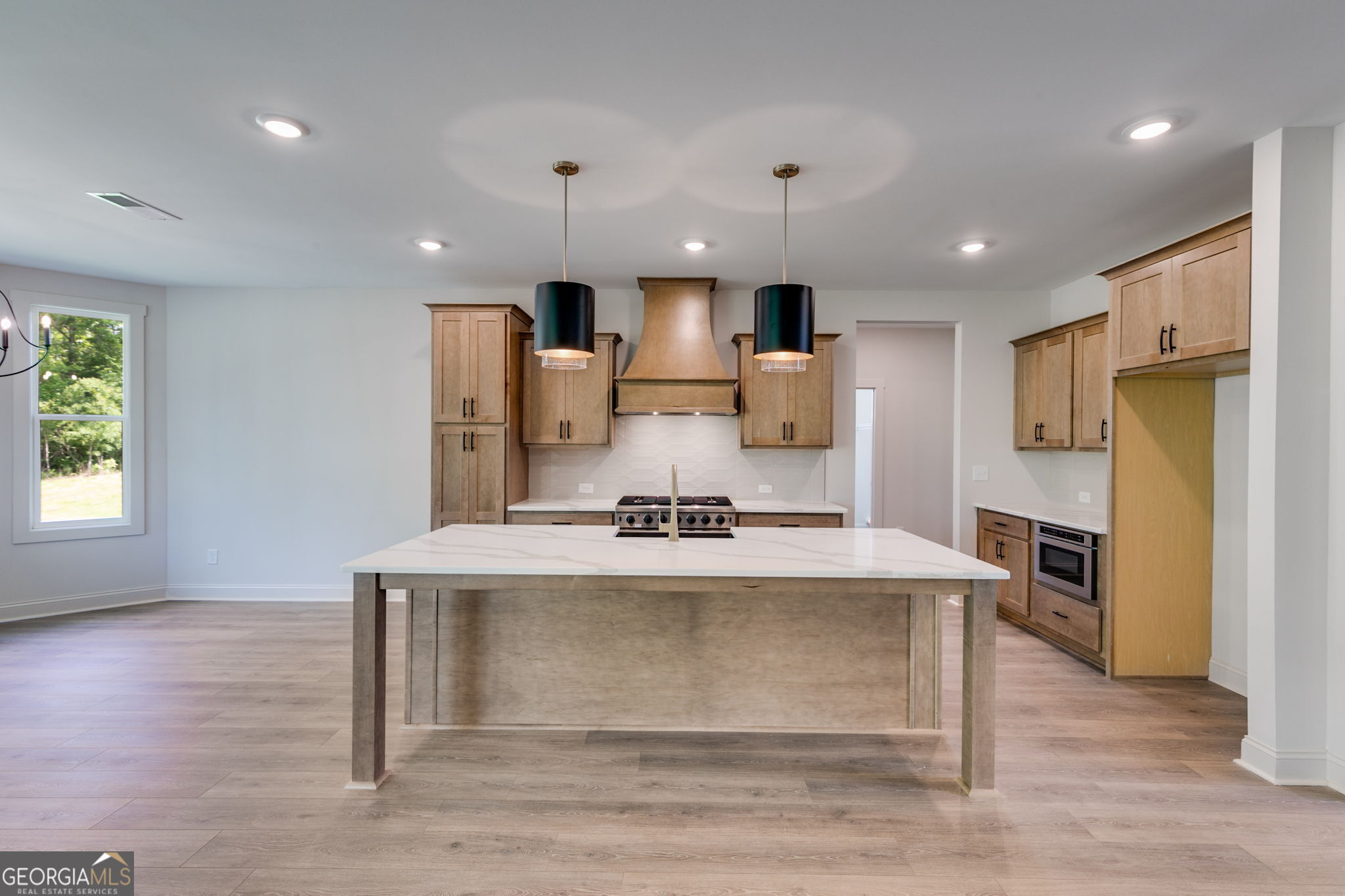 1593 Bethesda Church Road Carrollton, GA 30117 - Photo 18 of 50 a view of kitchen with cabinets microwave and refrigerator