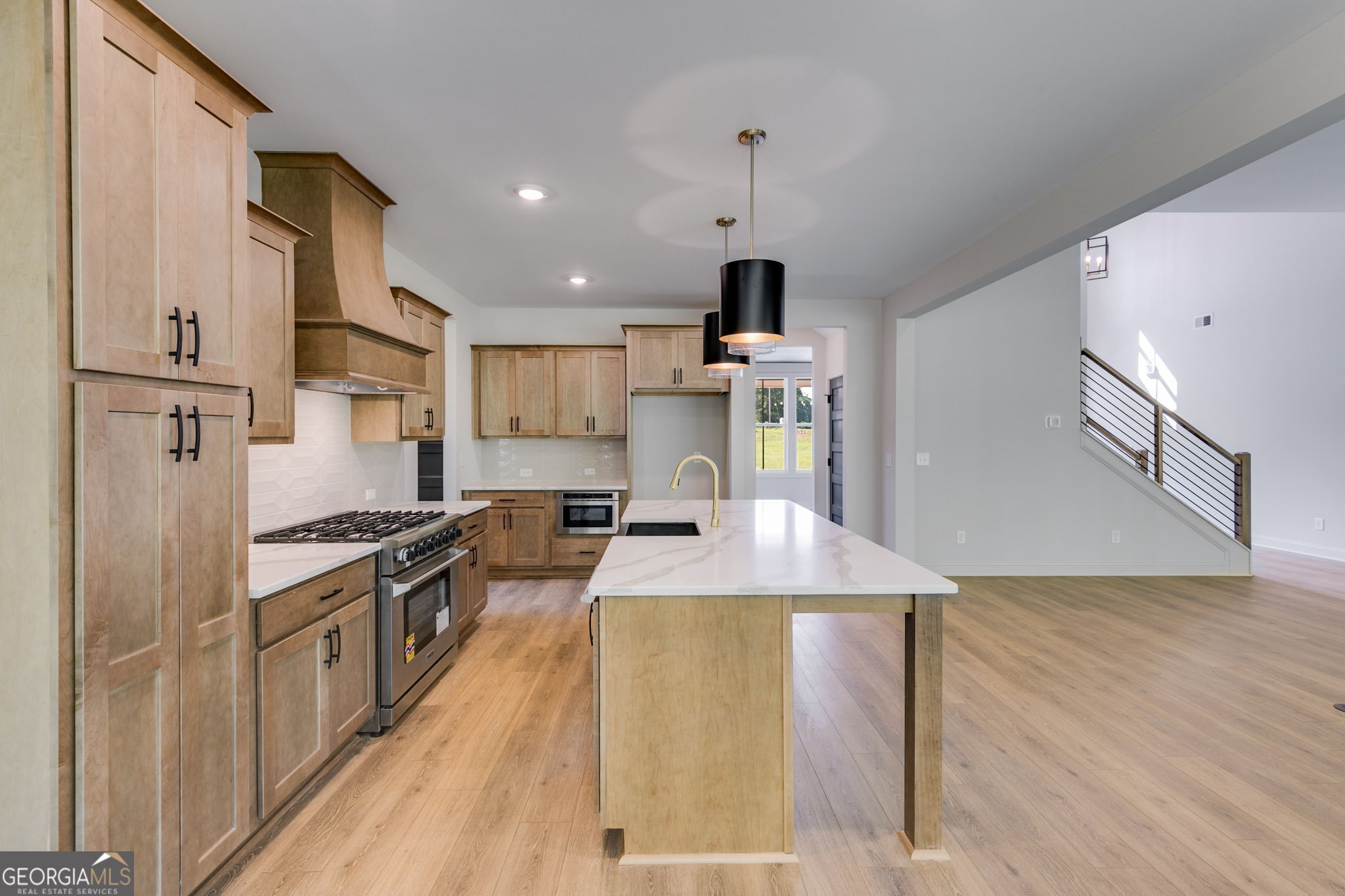 1593 Bethesda Church Road Carrollton, GA 30117 - Photo 21 of 50 a kitchen with stainless steel appliances granite countertop a sink a stove and a refrigerator