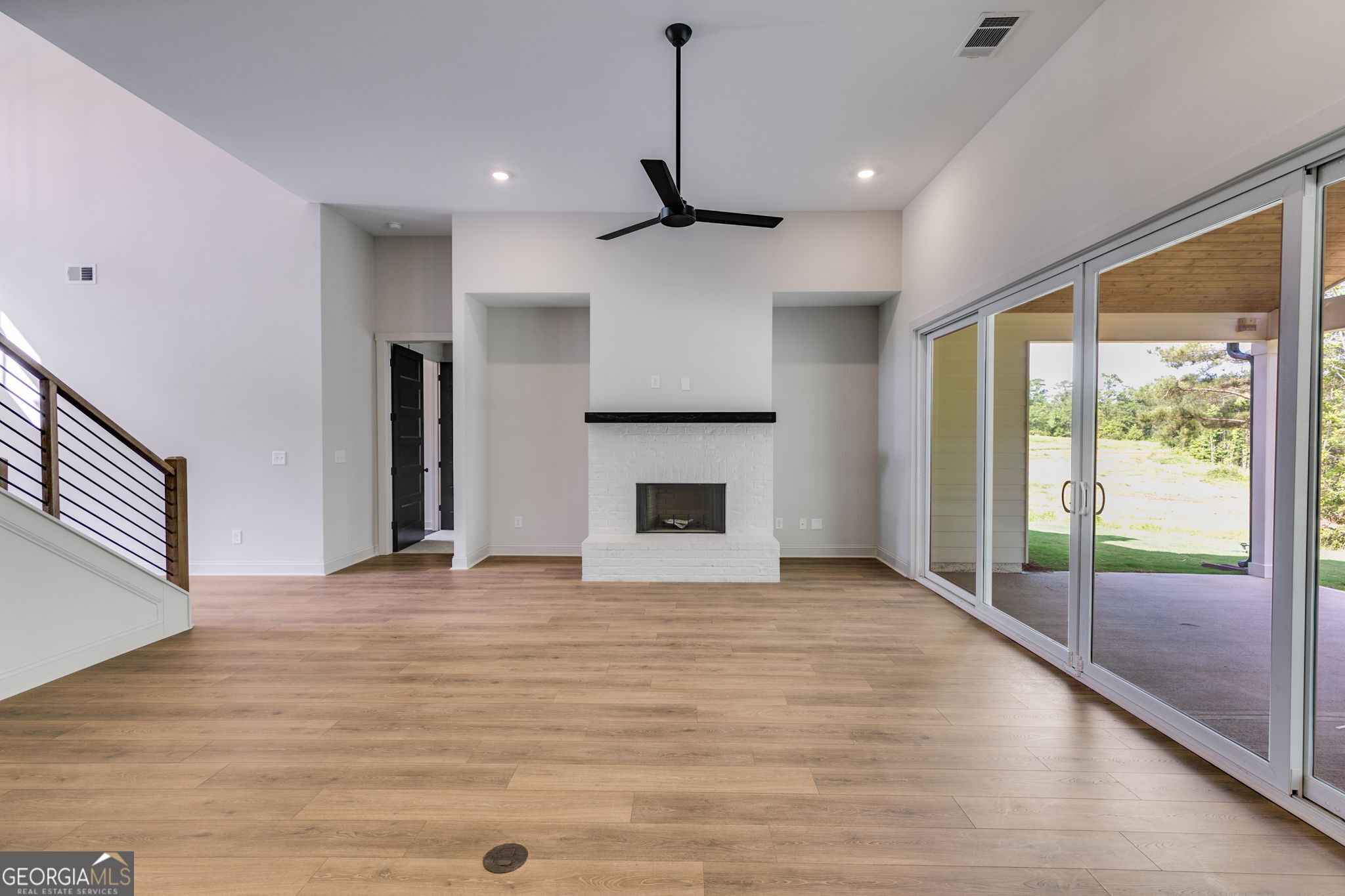 1593 Bethesda Church Road Carrollton, GA 30117 - Photo 23 of 50 a view of an empty room with window and wooden floor