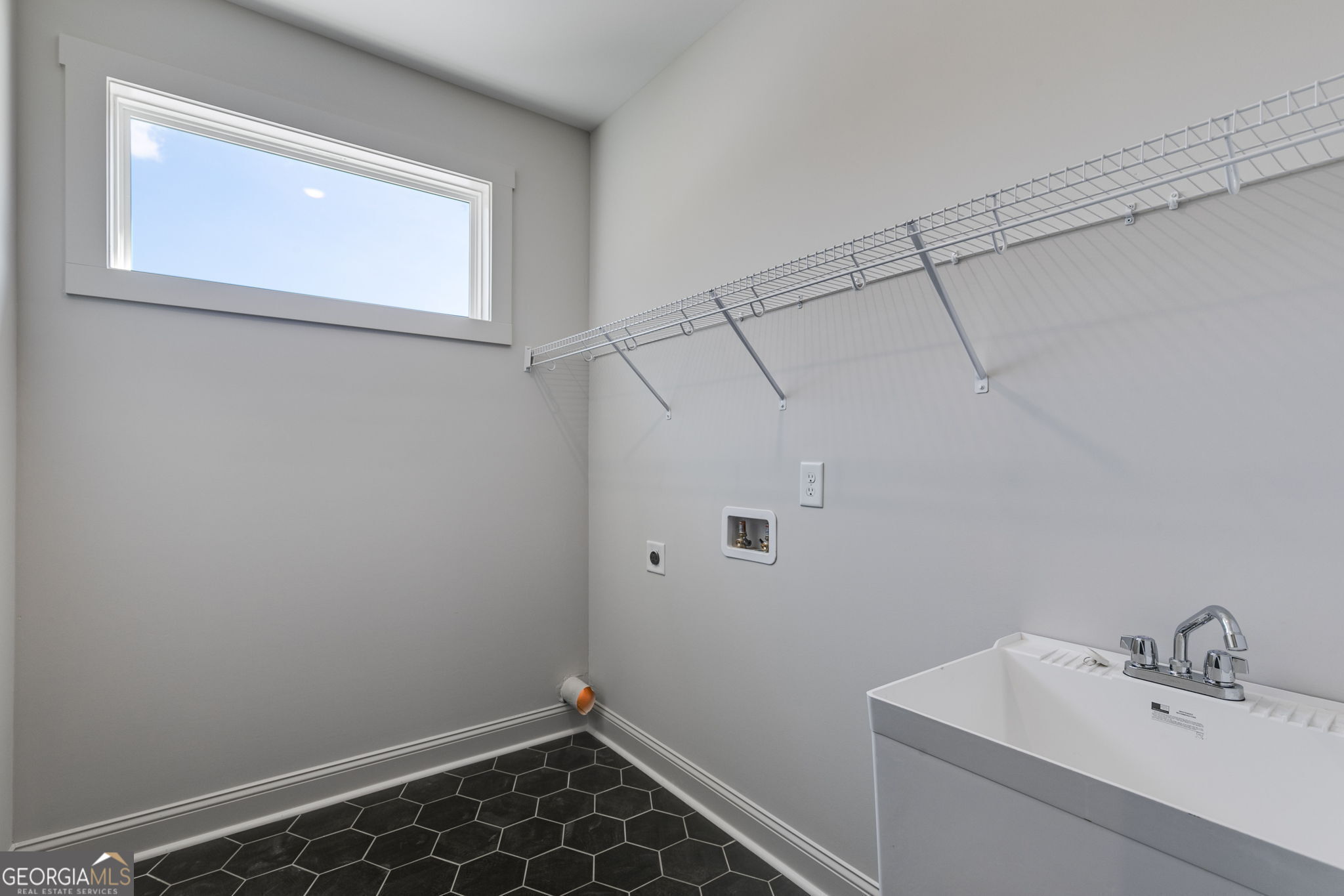 1593 Bethesda Church Road Carrollton, GA 30117 - Photo 27 of 50 a bathroom with a sink and vanity