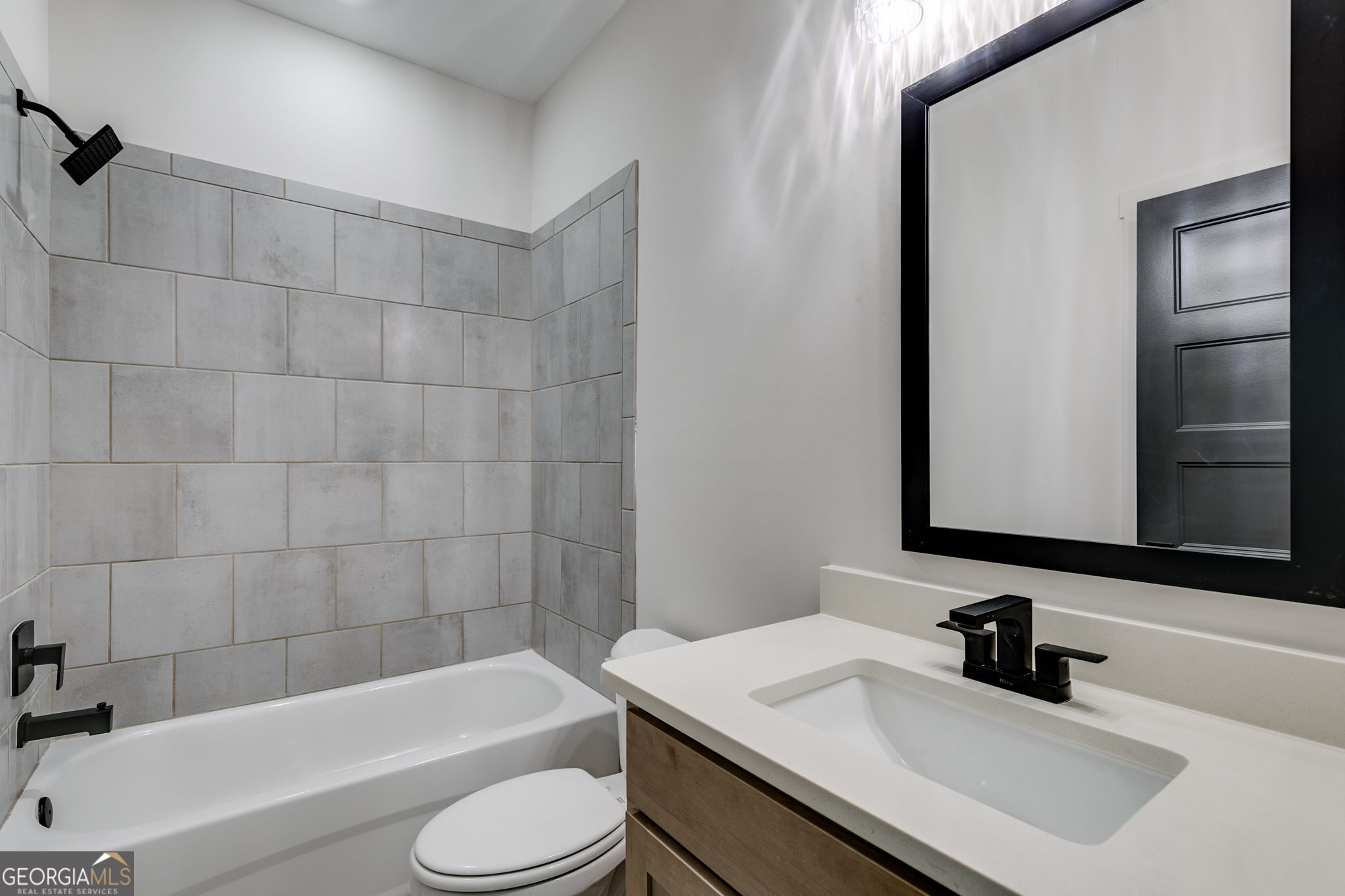 1593 Bethesda Church Road Carrollton, GA 30117 - Photo 28 of 50 a bathroom with a sink a toilet and bathtub