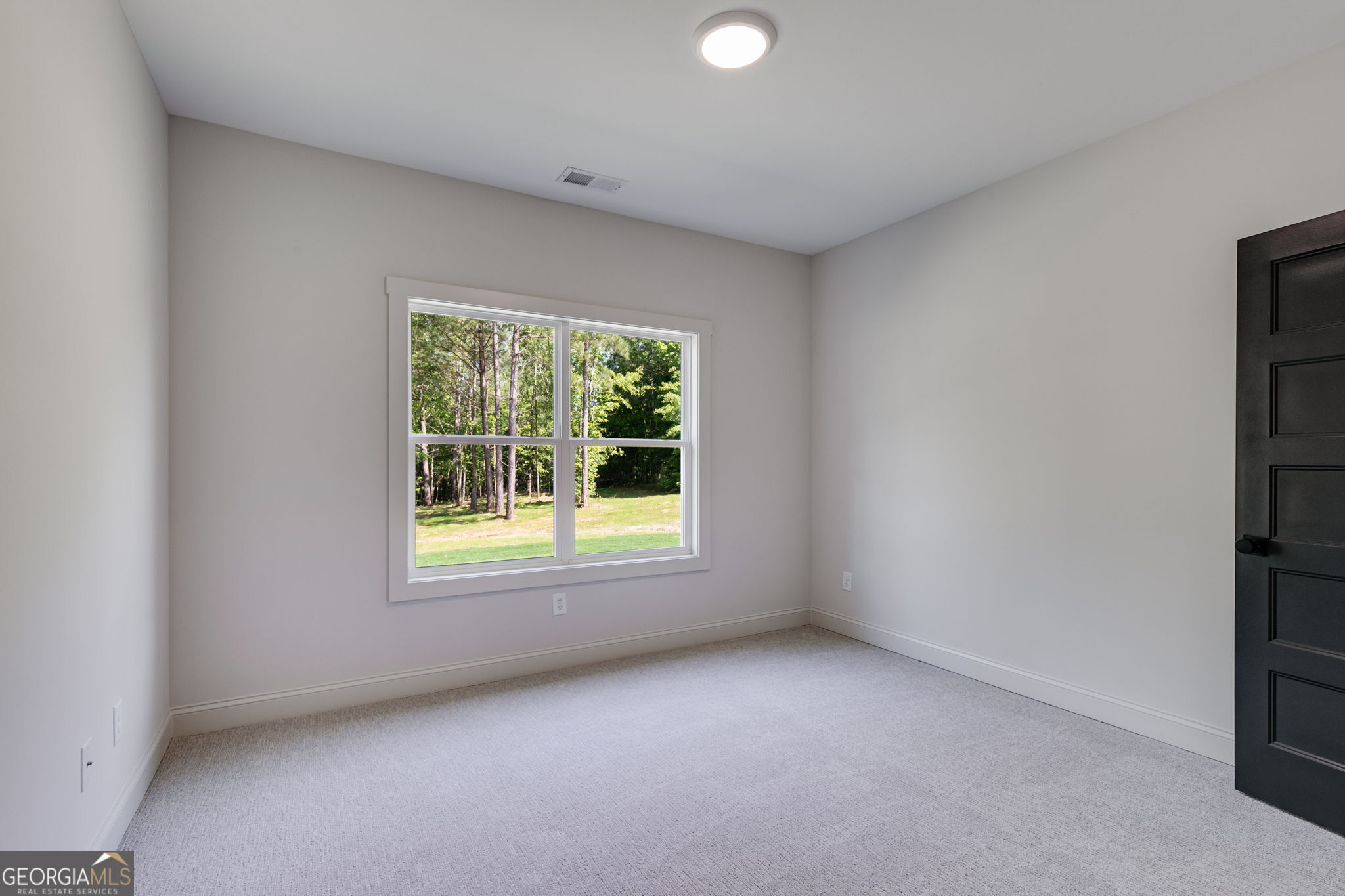 1593 Bethesda Church Road Carrollton, GA 30117 - Photo 29 of 50 an empty room with a window