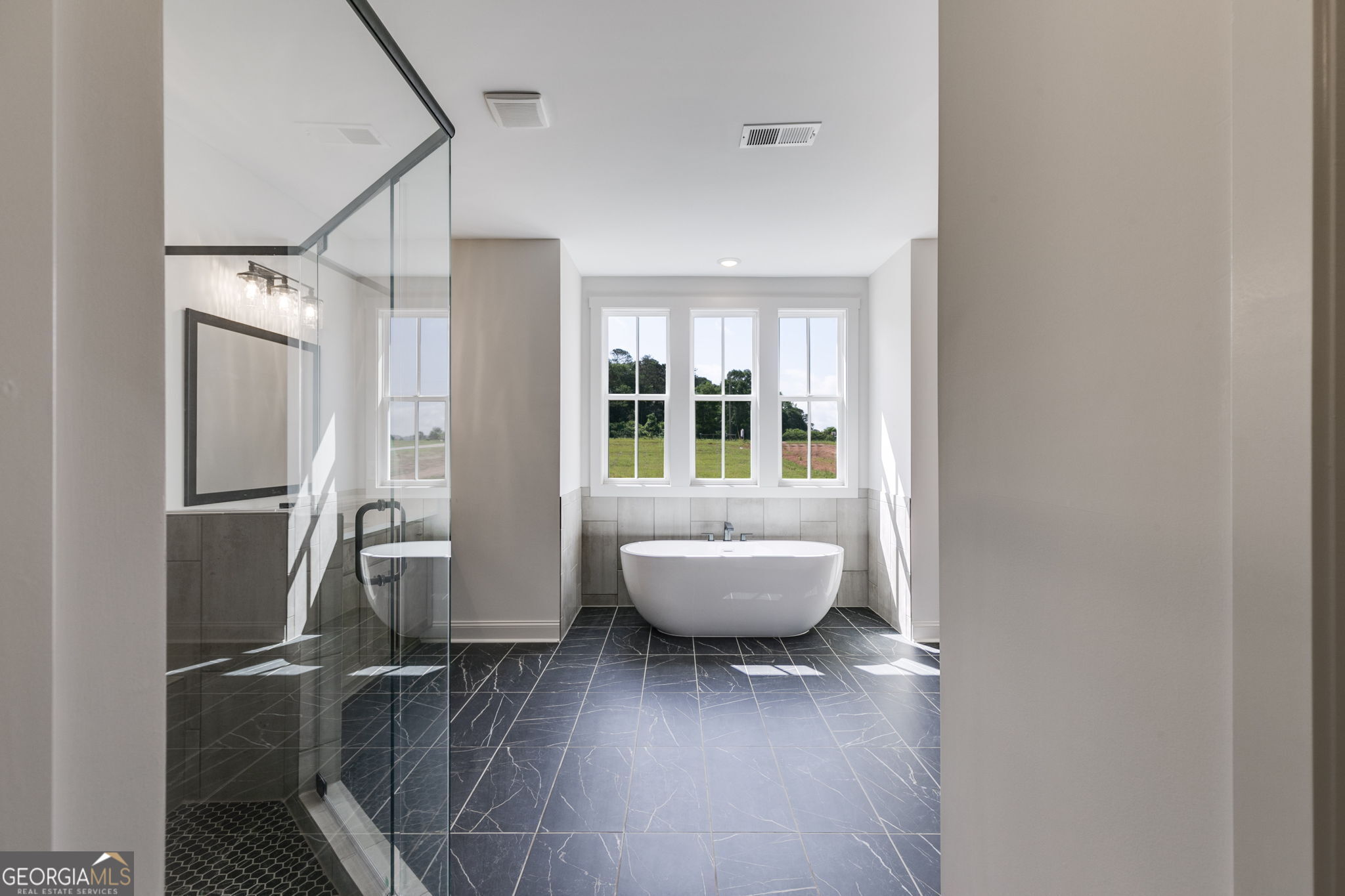 1593 Bethesda Church Road Carrollton, GA 30117 - Photo 34 of 50 a view of an empty room with wooden floor and a window