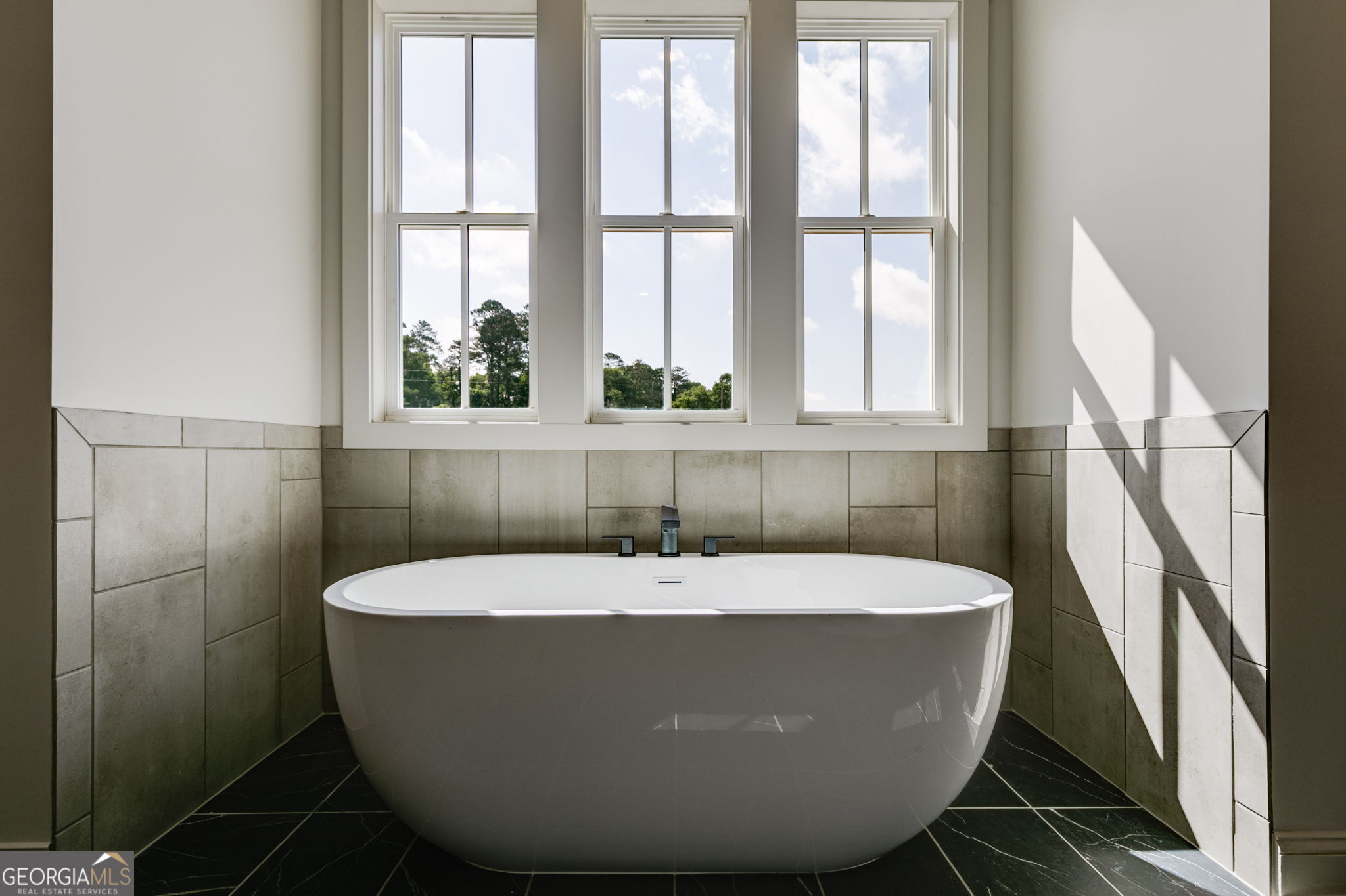 1593 Bethesda Church Road Carrollton, GA 30117 - Photo 35 of 50 a white bath tub sitting in a bathroom