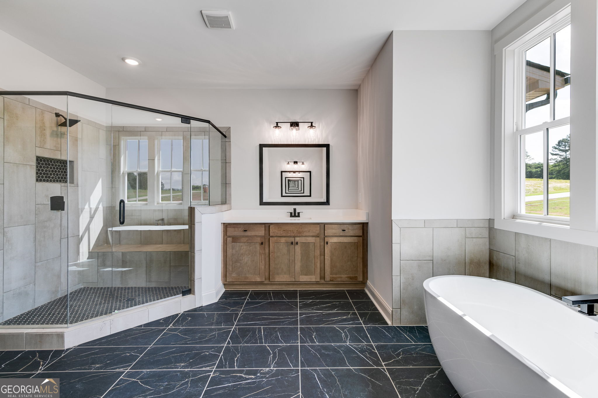1593 Bethesda Church Road Carrollton, GA 30117 - Photo 36 of 50 a bathroom with a bathtub shower sink and mirror