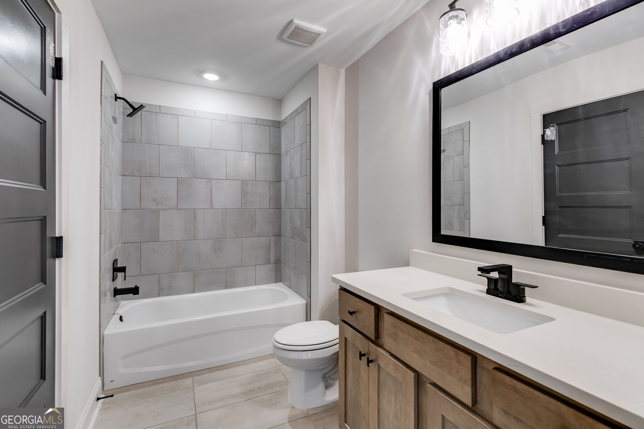 1593 Bethesda Church Road Carrollton, GA 30117 - Photo 42 of 50 a bathroom with a granite countertop sink toilet and shower