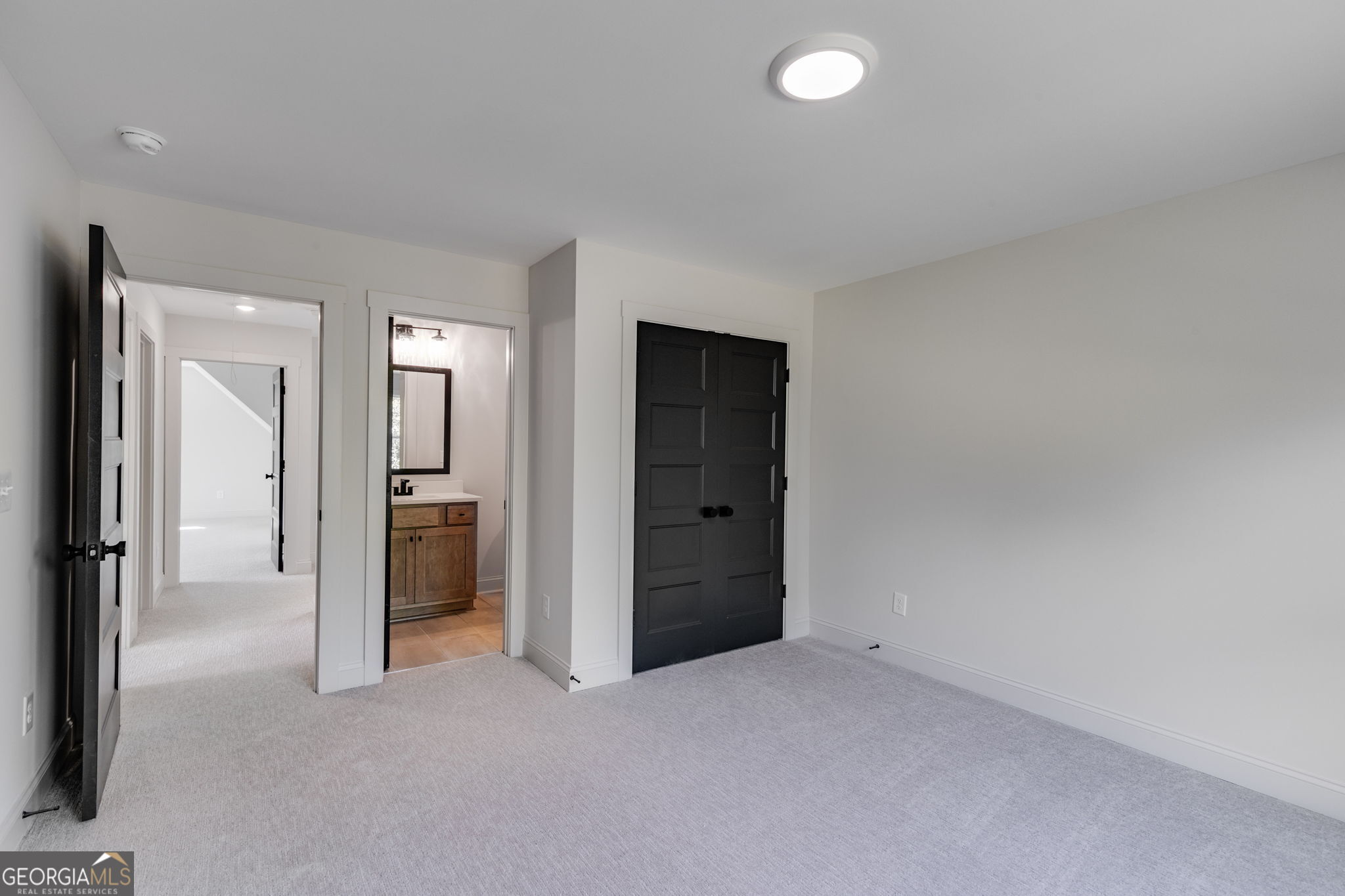 1593 Bethesda Church Road Carrollton, GA 30117 - Photo 45 of 50 an empty room with closet and a bathroom