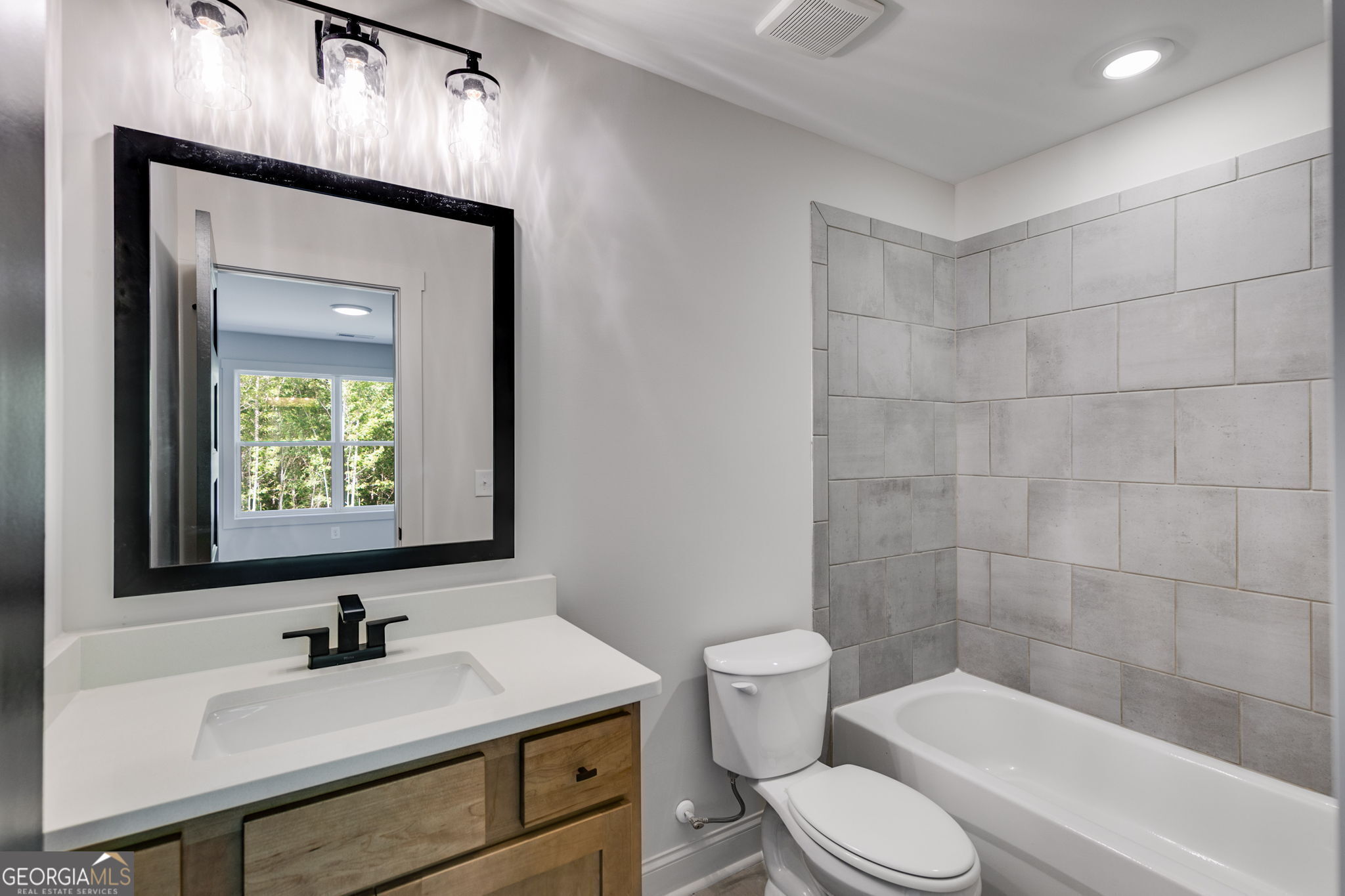 1593 Bethesda Church Road Carrollton, GA 30117 - Photo 46 of 50 a bathroom with a sink toilet and shower