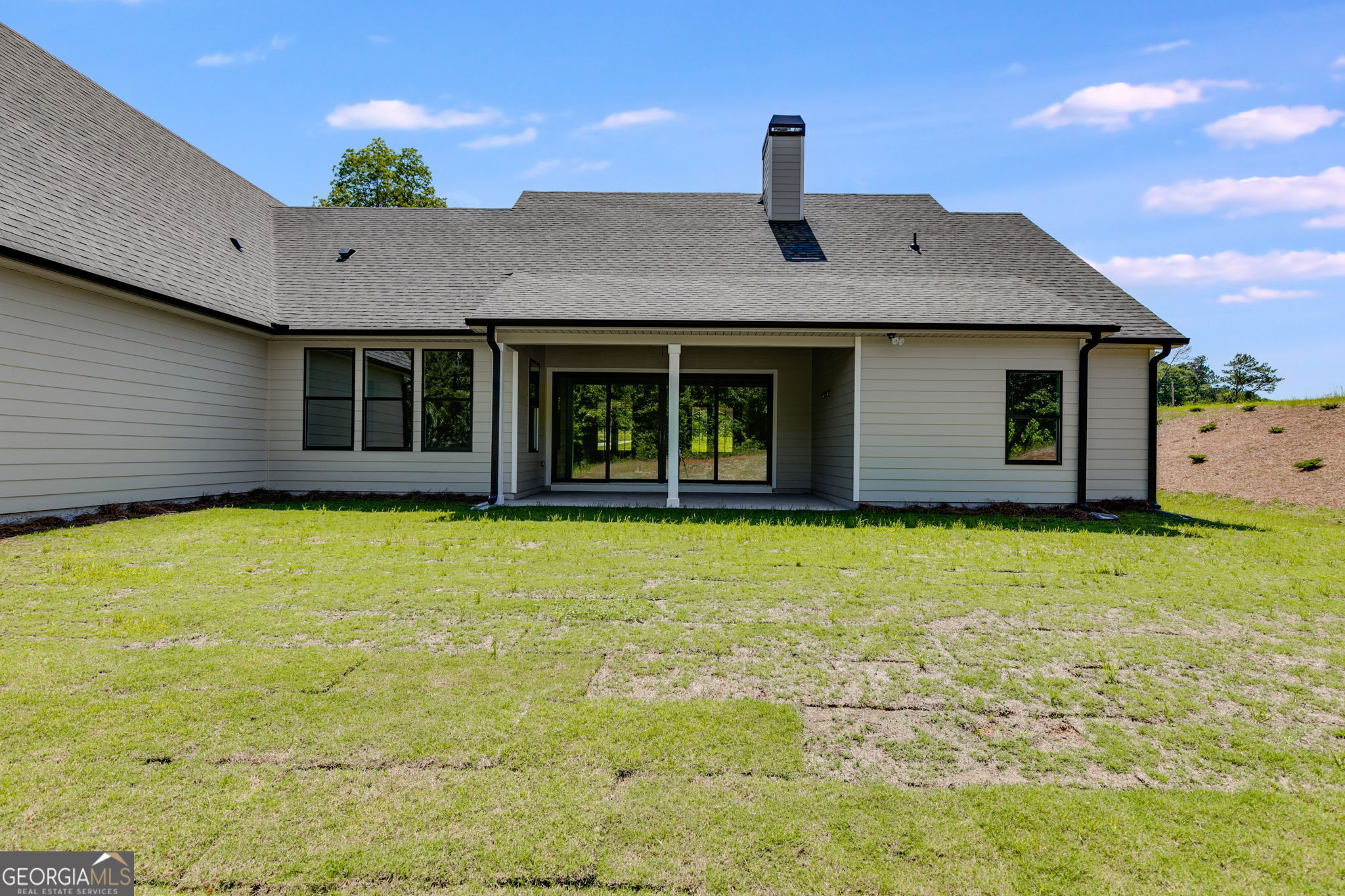 1593 Bethesda Church Road Carrollton, GA 30117 - Photo 48 of 50 a front view of a house with a garden