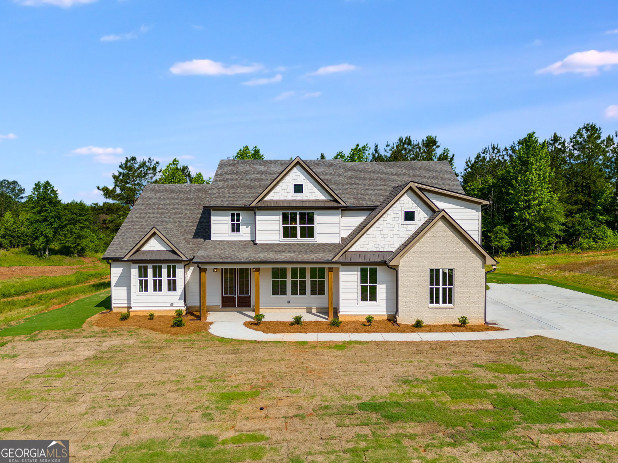 1593 Bethesda Church Road Carrollton, GA 30117 - Photo 6 of 50 a front view of a house with garden