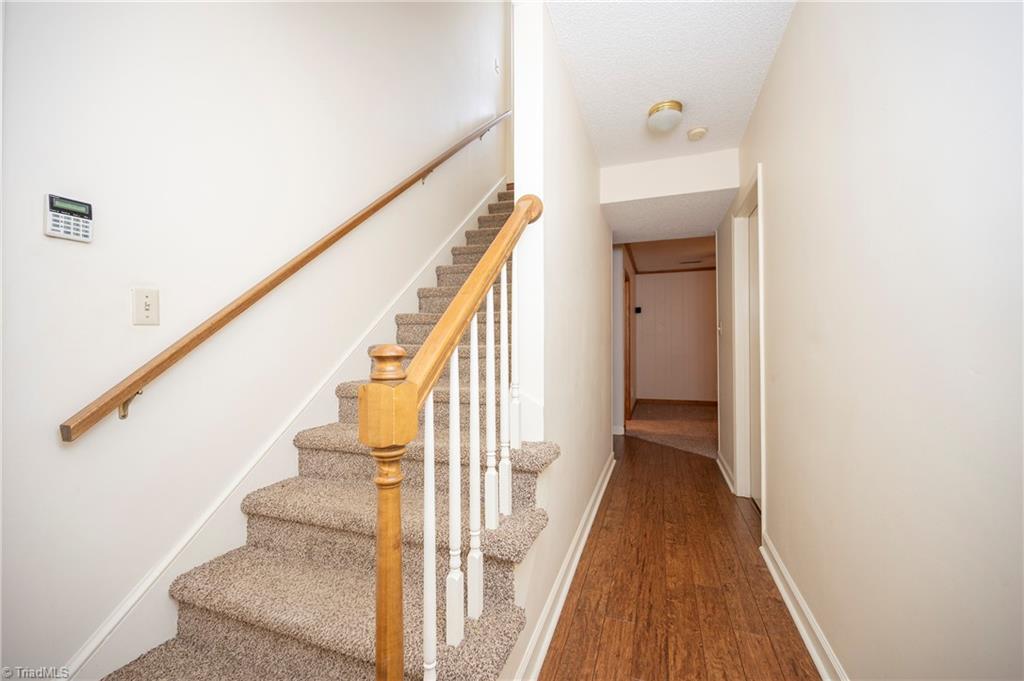 593 Barkworth Road Clemmons, NC 27012 - Photo 34 of 48 Basement Staircase and Hallway