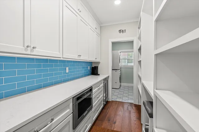 a kitchen with a sink and a stove top oven