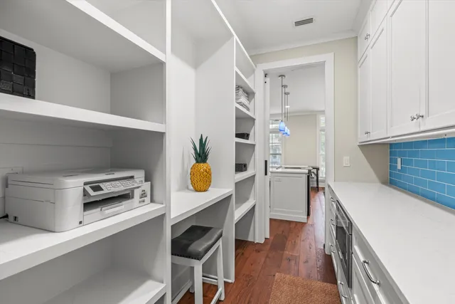 a kitchen with a sink and a stove top oven