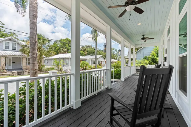 a view of a two chairs in the balcony