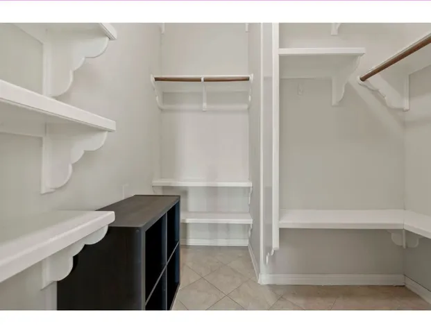 a kitchen with stainless steel appliances granite countertop a stove refrigerator sink and cabinets