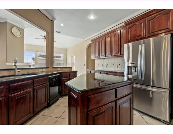 a view of a kitchen with furniture and a kitchen view
