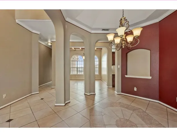 a view of a livingroom with furniture and chandelier