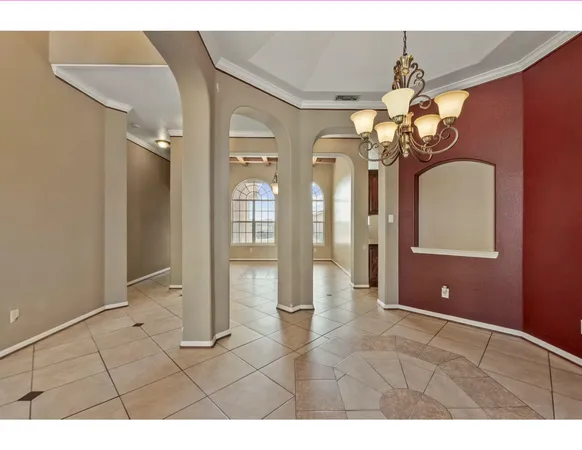 a view of a livingroom with furniture and chandelier