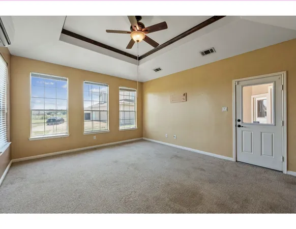 a view of a livingroom with a ceiling fan