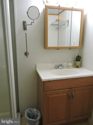 a bathroom with a sink and mirror