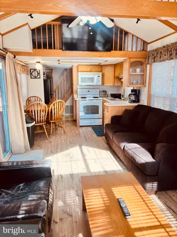 a view of a patio with couches table and chairs