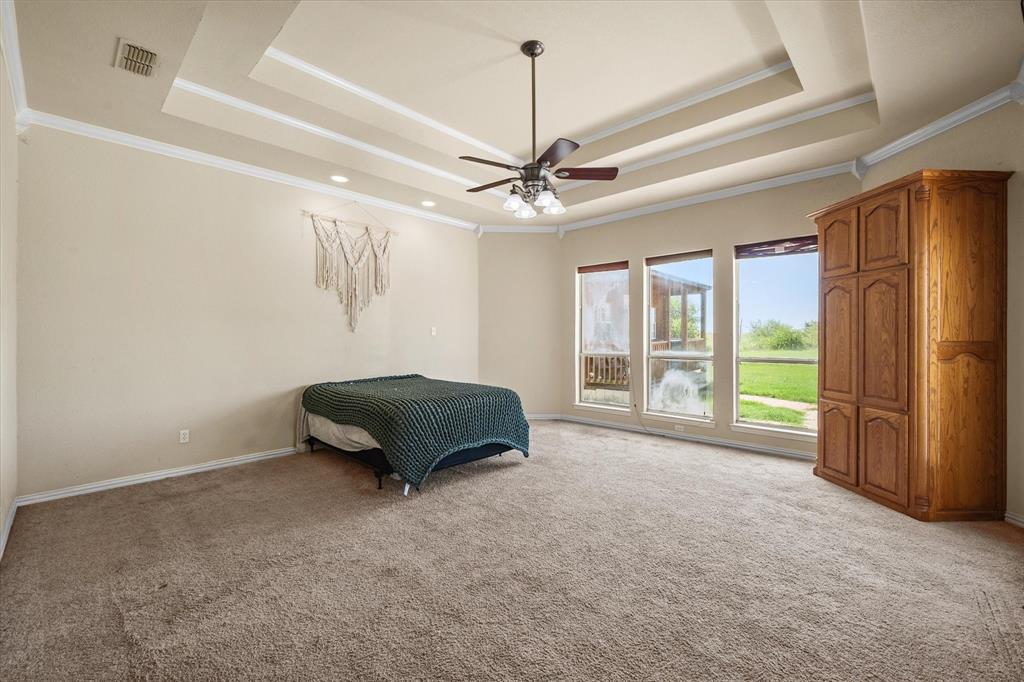 14981 West State Highway Blooming Grove, TX 76626 - Photo 14 of 40 a view of a livingroom with a ceiling fan and window