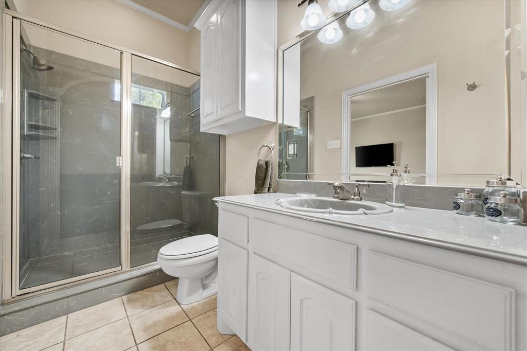 14981 West State Highway Blooming Grove, TX 76626 - Photo 22 of 40 a bathroom with a sink toilet and shower