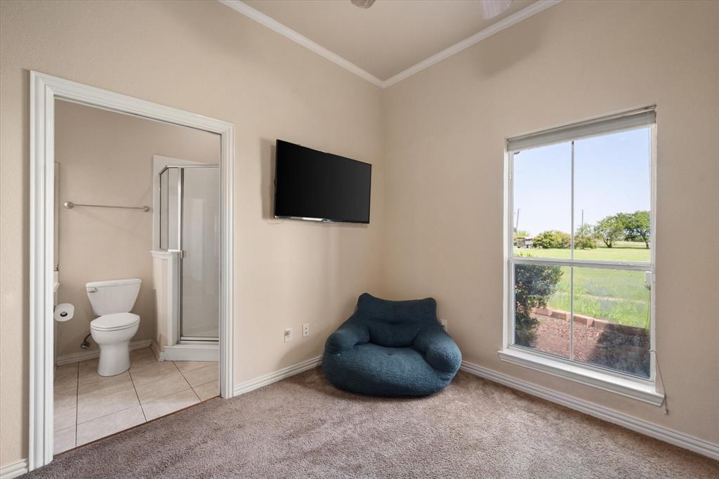 14981 West State Highway Blooming Grove, TX 76626 - Photo 28 of 40 a living room with furniture and a flat screen tv
