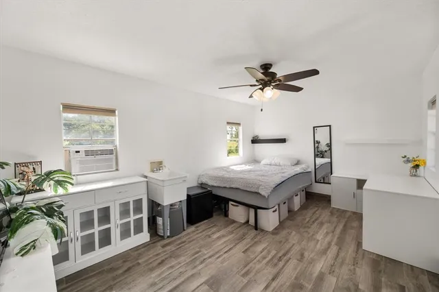 a room with furniture and wooden floor