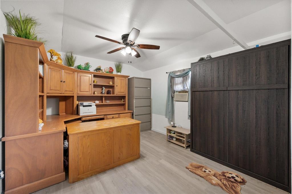 14981 West State Highway Blooming Grove, TX 76626 - Photo 35 of 40 a kitchen with stainless steel appliances a refrigerator and a fireplace