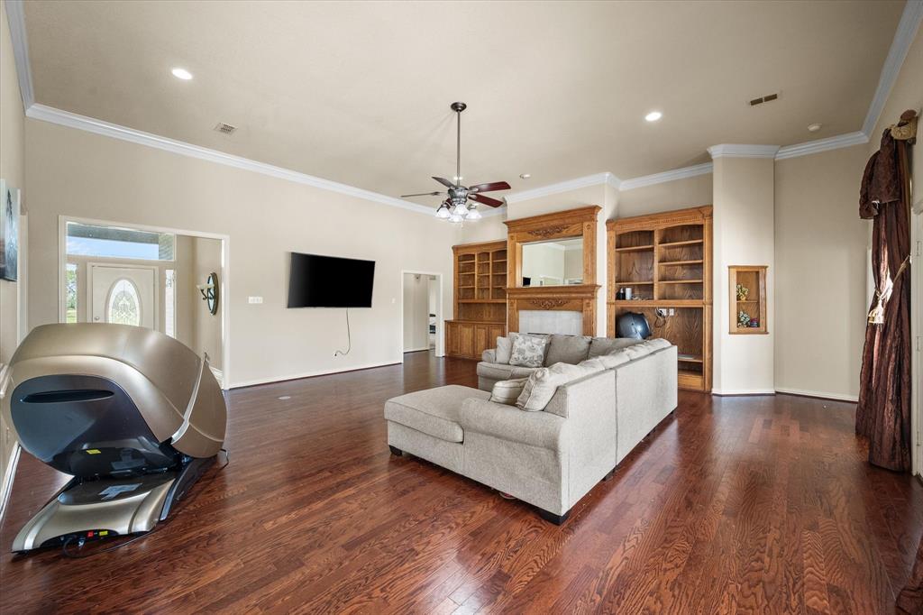 14981 West State Highway Blooming Grove, TX 76626 - Photo 8 of 40 a living room with furniture fireplace and flat screen tv