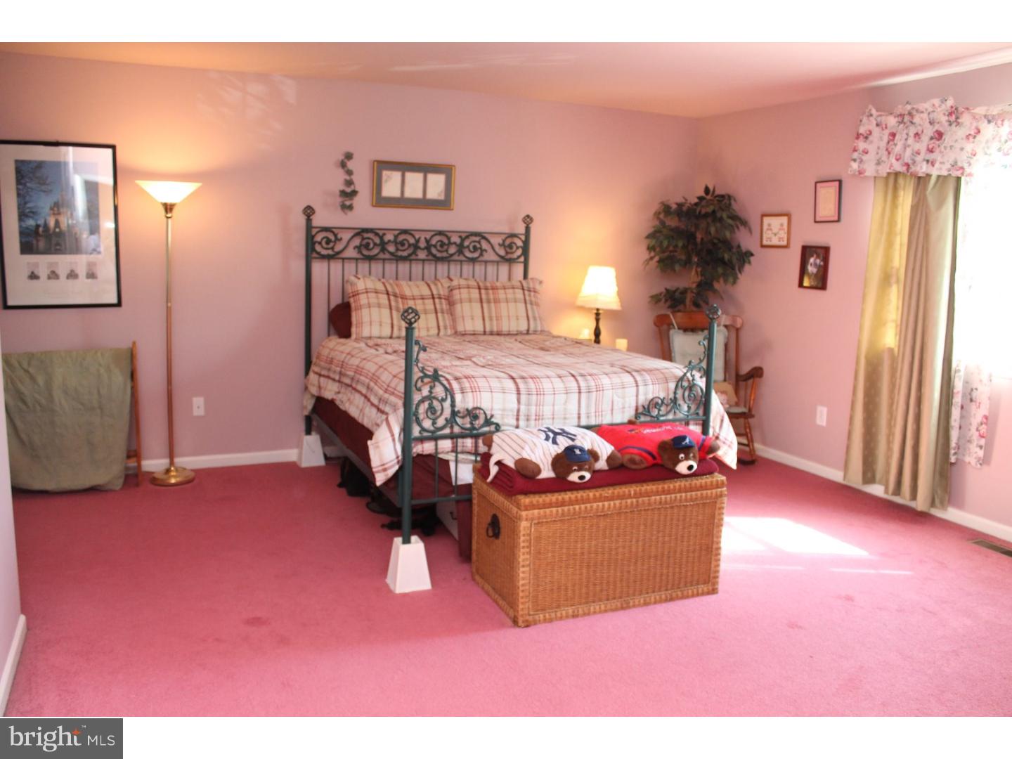 716 South Sandy Lane Sinking Spring, PA 19608 - Photo 8 of 19 a bed room with furniture and a flat screen tv