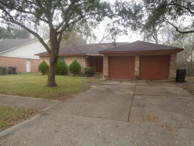 a house with a tree in front of it