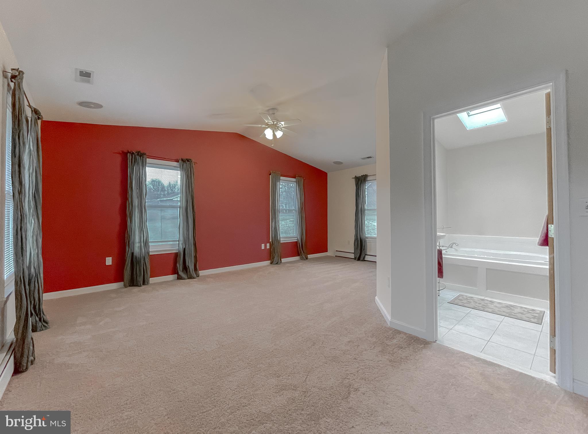 4485 Solomons Island Road Huntingtown, MD 20639 - Photo 9 of 46 a view of an empty room with wooden floor and entryway