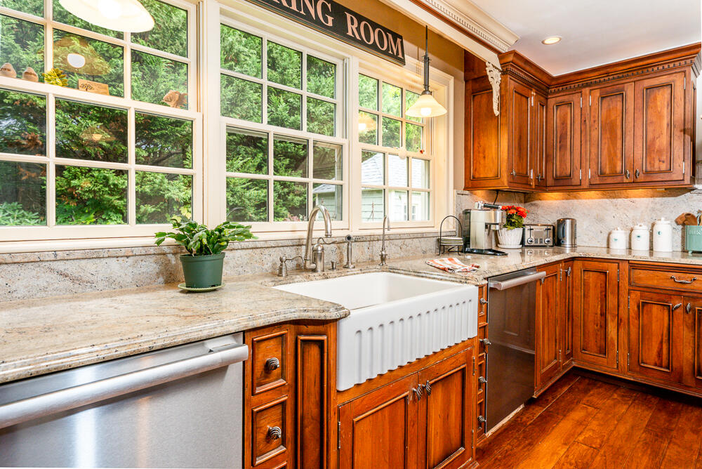 5 Pine Street Sandwich, MA 02563 - Photo 30 of 74 a kitchen with stainless steel appliances granite countertop a sink a counter space and a window