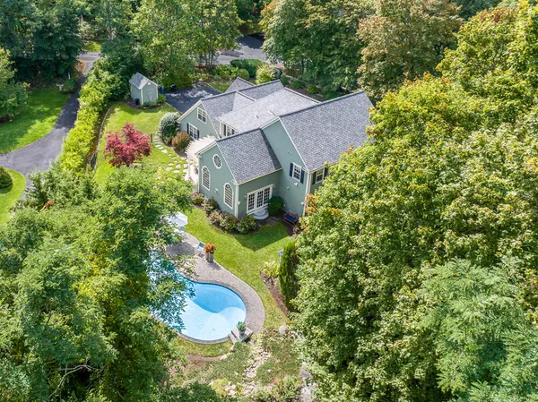 an aerial view of a house with a garden