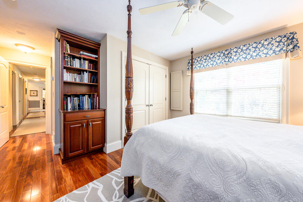 5 Pine Street Sandwich, MA 02563 - Photo 42 of 74 a bedroom with a bed and a book shelf