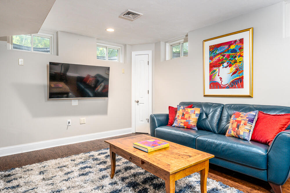 5 Pine Street Sandwich, MA 02563 - Photo 56 of 74 a living room with a couch and a flat screen tv