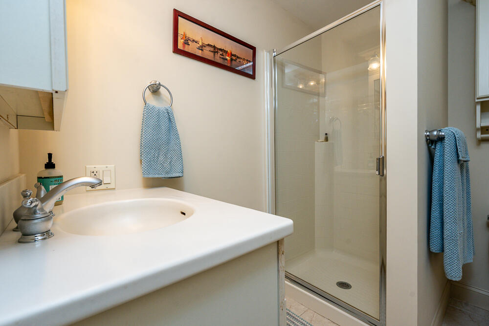 5 Pine Street Sandwich, MA 02563 - Photo 60 of 74 a bathroom with a sink and a mirror