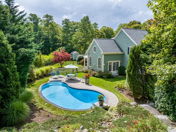 a front view of a house with a garden