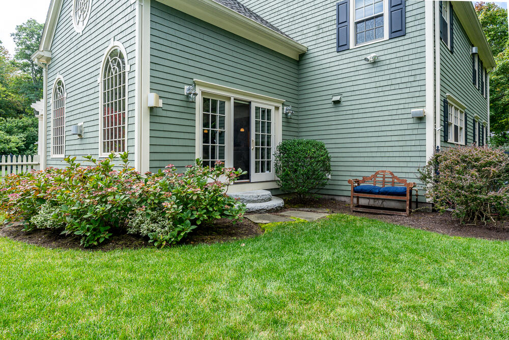 5 Pine Street Sandwich, MA 02563 - Photo 72 of 74 a front view of a house with a garden