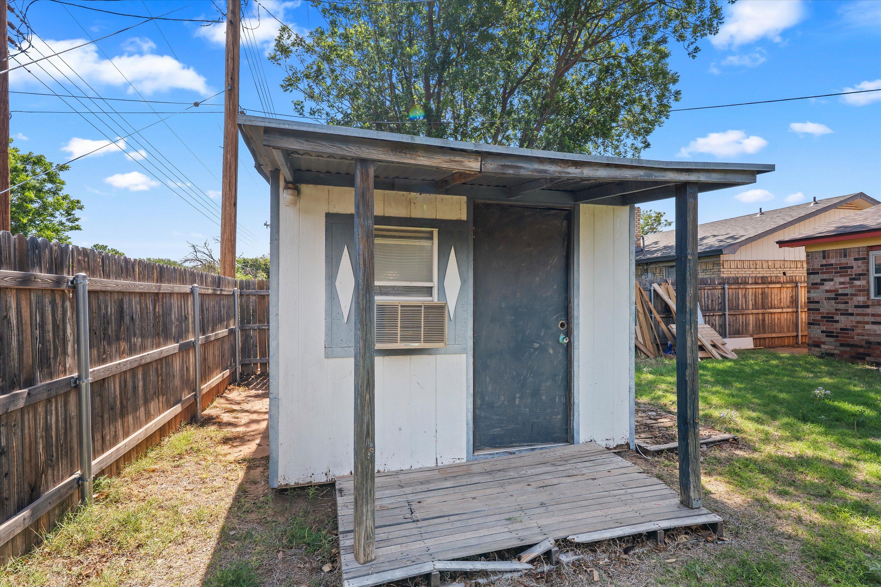 4520 54th Street Lubbock, TX 79414 - Photo 29 of 32 a view of a wooden deck front of house
