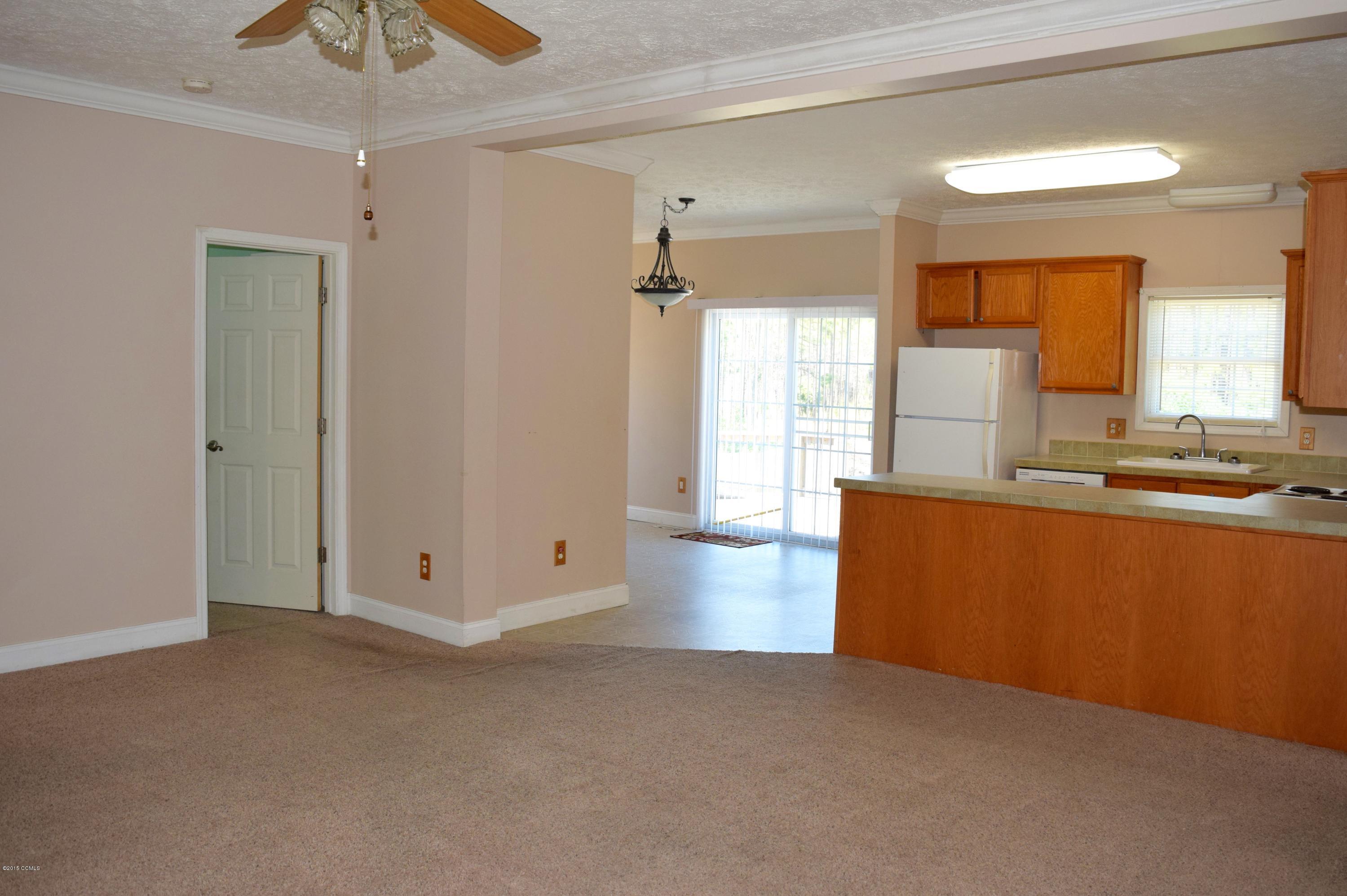 189 Cagle Road Newport, NC 28570 - Photo 5 of 14 LIVING ROOM VIEW INTO KITCHEN 110