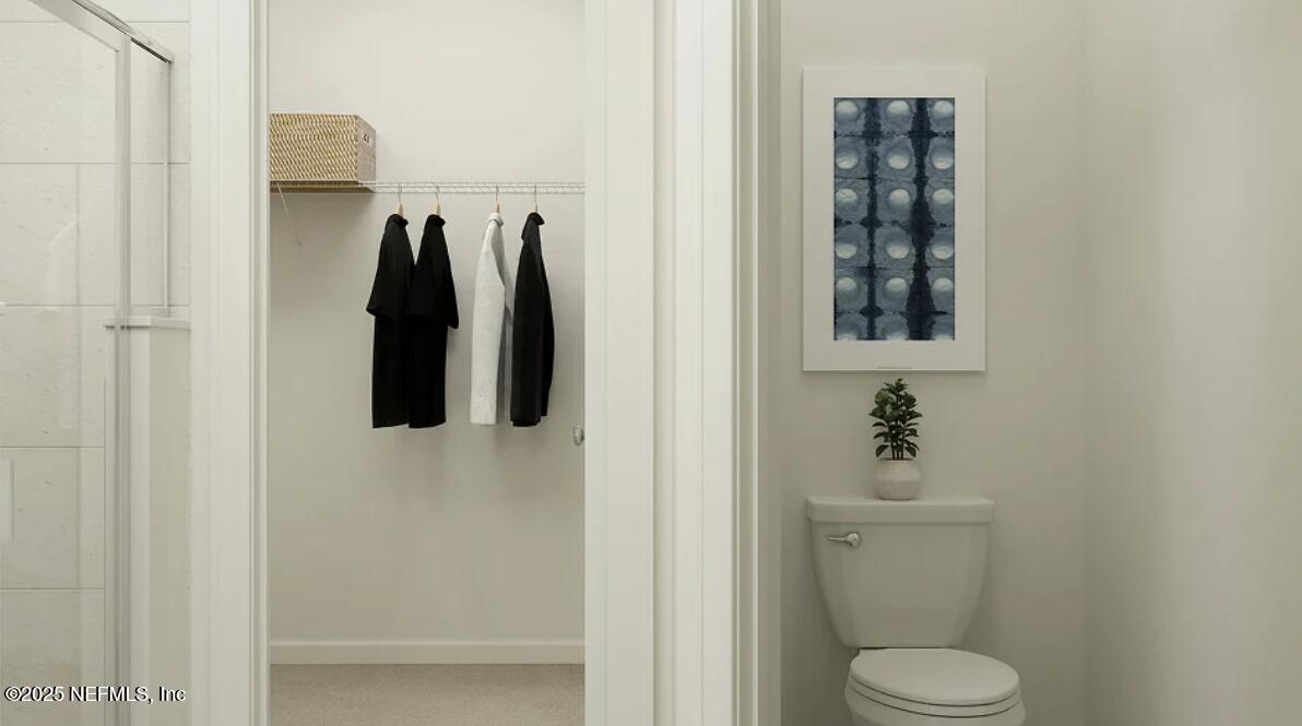 76037 Estuary Way Yulee, FL 32097 - Photo 25 of 38 a bathroom with a toilet sink and shower