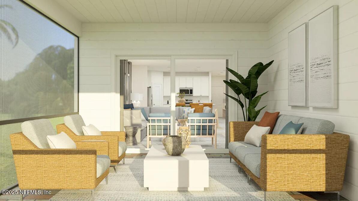 76037 Estuary Way Yulee, FL 32097 - Photo 31 of 42 a living room with furniture and a potted plant