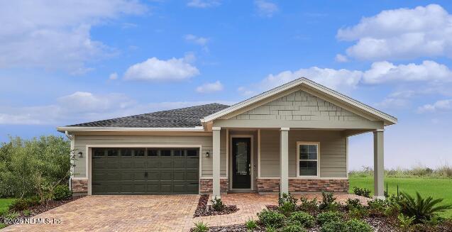 76037 Estuary Way Yulee, FL 32097 - Photo 38 of 38 a front view of a house with garden