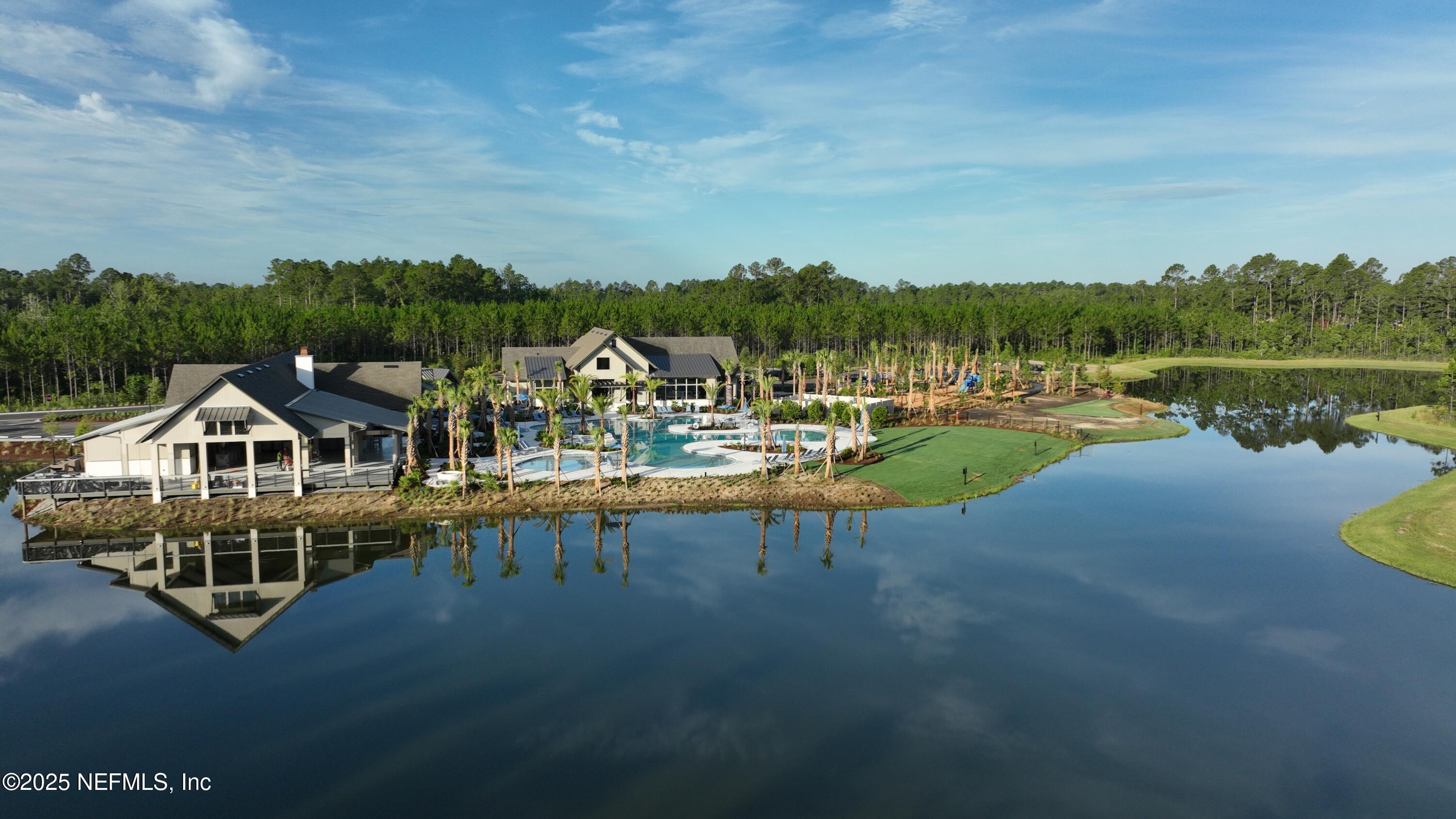 76037 Estuary Way Yulee, FL 32097 - Photo 4 of 38 a view of a lake with houses