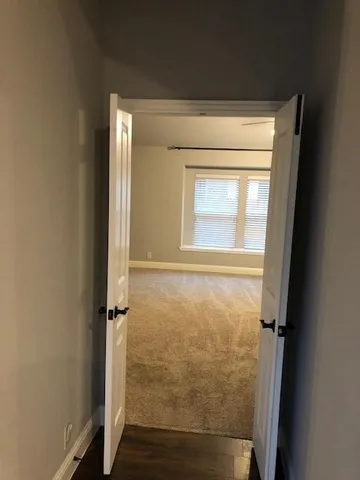 a view of an empty room with a window