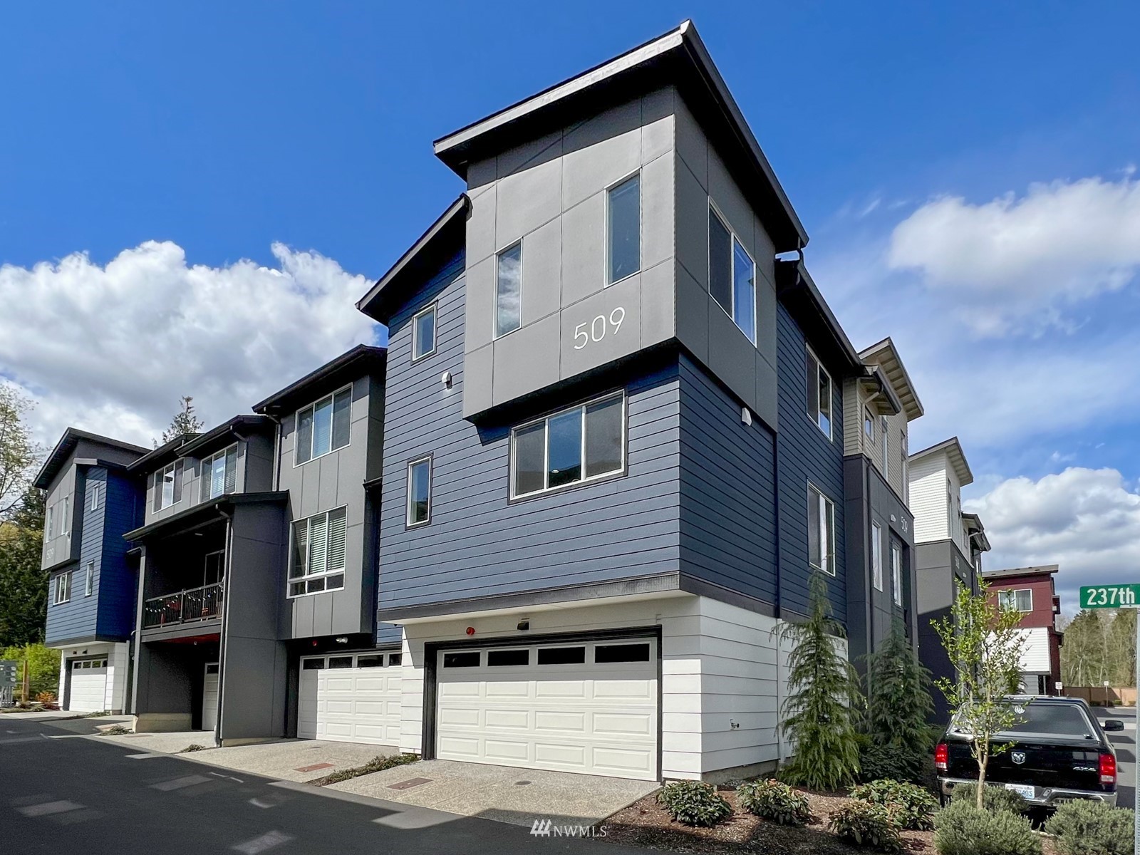 509 237th Place Southeast, Unit E Bothell, WA 98021 - Photo 1 of 35 a front view of a house with a yard