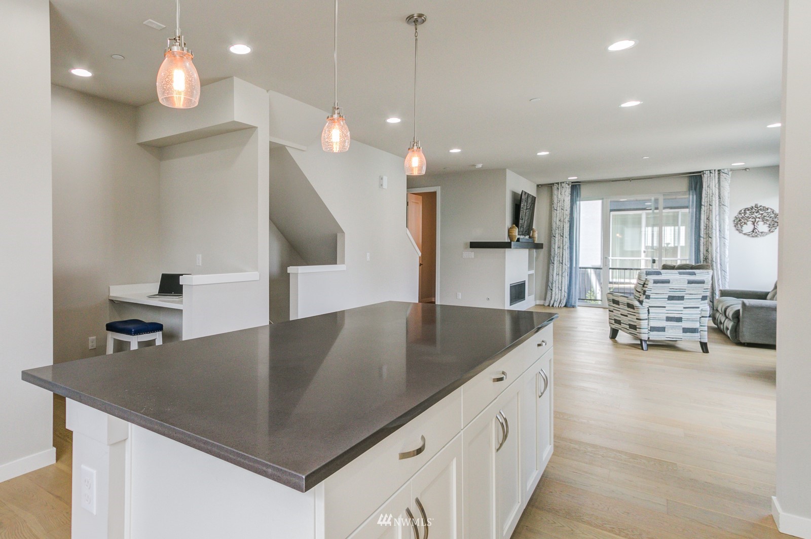 509 237th Place Southeast, Unit E Bothell, WA 98021 - Photo 11 of 35 a kitchen with counter and chairs